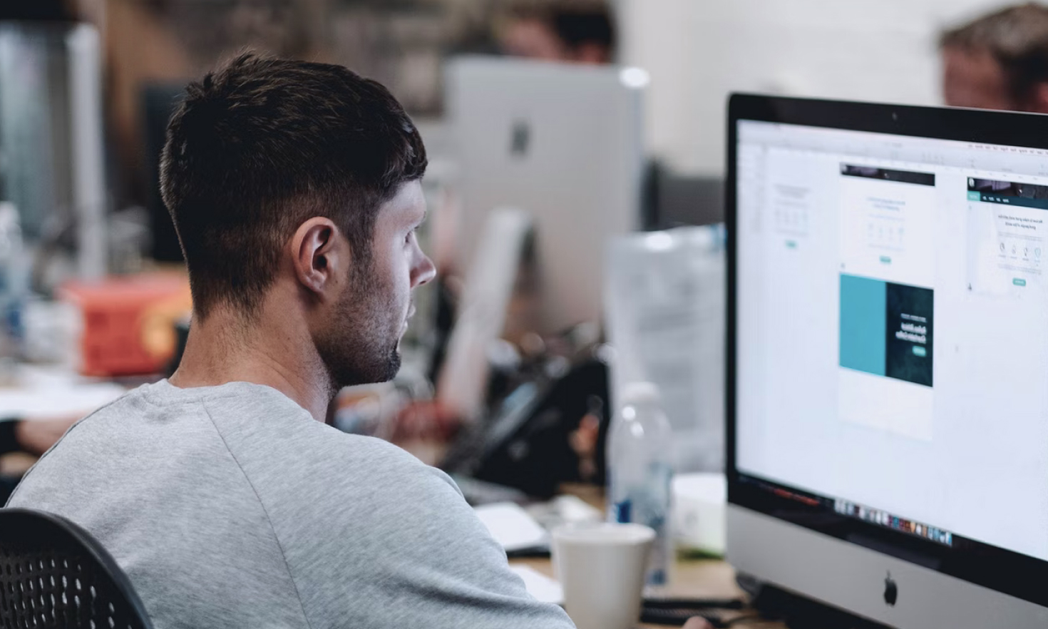 seo specialist working looking at a computer monitor and working on a client's website