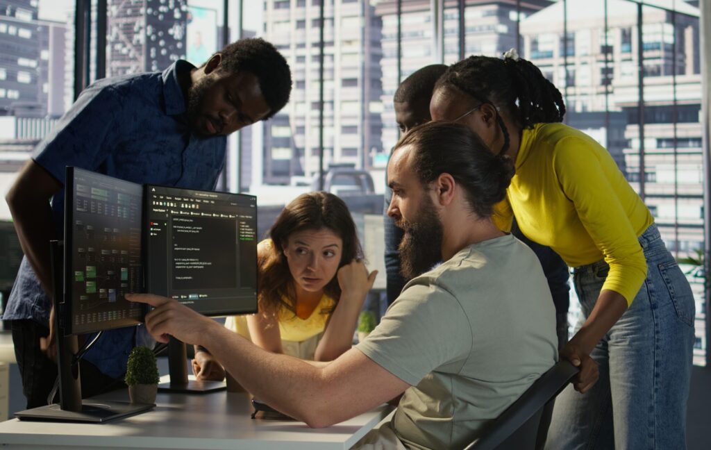 Team of software engineers doing brainstorming in office