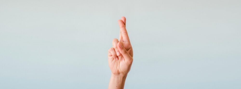 Someone with their fingers crossed.