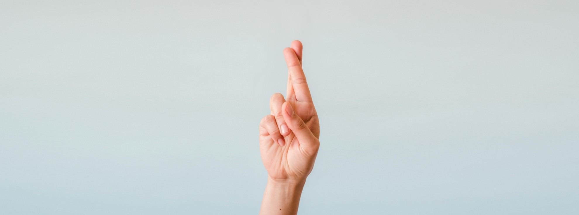 Someone with their fingers crossed.